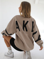 Blakely Isabel Womens Oversized Jumper Tan Kneeling